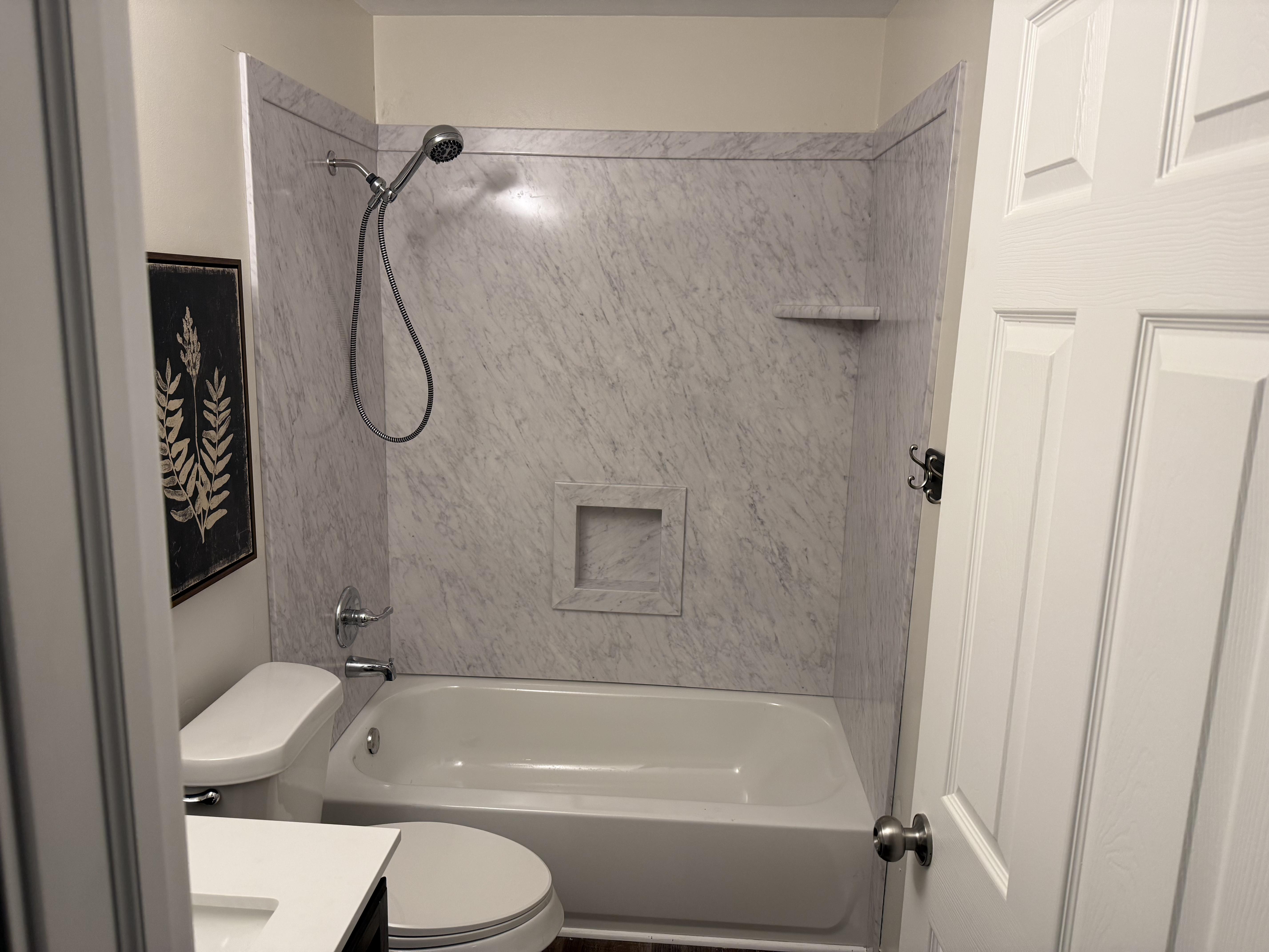 Modern bathroom renovation with custom tile shower